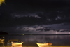 Perhentian Island, Terengganu, Malaysia: Flora Bay - two white boats on beach during a lightning storm - photo by S.Egeberg
