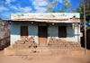 Cape Maclear / Chembe, Malawi: house with piles of mud bricks under a zinc porch - Nankumba Peninsula - photo by M.Torres