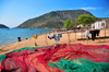 Cape Maclear / Chembe, Malawi: Lake Malawi / Lake Nyasa - colourful fishing nets on the beach and the cape - Nankumba Peninsula - photo by M.Torres