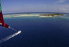 Maldives Parasailing with island, Four Seasons resort, Kuda Huraa (photo by B.Cain)