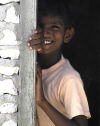 Maldives / Maldivas - Male / MLE:  local boy on doorway  (photo by B.Cain)