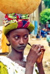 Djenn, Mopti Region, Mali: coquette girl with water pot - photo by N.Cabana