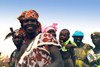 Djenn, Mopti Region, Mali: women returning to the village after a day at the market - photo by N.Cabana