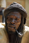 Djenn, Mopti Region, Mali: portrait of a medicine man smoking a pipe at monday market - photo by J.Pemberton