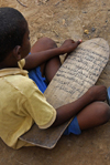 Djenn, Mopti Region, Mali: boy studying Quranic verses on a wooden tablet at the Madrassa - photo by J.Pemberton