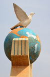 Bamako, Mali: Peace Monument - hands holding planet Earth with a peace dove - photo by M.Torres