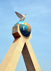 Bamako, Mali: Peace Monument - detail of arms holding a globe with a peace dove - phot by M.Torres