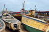 Nouakchott, Mauritania: traditional wooden fishing boats, locally built and painted - fishing harbor, the Port de Pche - photo by M.Torres