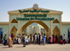 Nouakchott, Mauritania: people wait outside the gates of Nouakchott City Hall, guards allowing only one person at a time - Communaut Urbaine de Nouakchott - photo by M.Torres