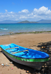 Pamandzi, Petite-Terre, Mayotte: beach - boat with M'Bouzi islet and Mahor island in the background - photo by M.Torres