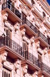 Spain - Melilla: pink faade - balconies with console brackets - | fachada rosa - photo by M.Torres