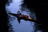Xochimilco, DF: canoe - indian woman rowing in a canal - photo by Y.Baby