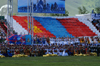 Ulan Bator / Ulaanbaatar, Mongolia: Naadam festival - giant flag and singers at the opening ceremony - photo by A.Ferrari