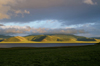 Khorgo-Terkhiin Tsagaan Nuur NP, Mongolia: hills and lake in the evening light - photo by A.Ferrari