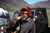 Mongolia - Altai - western Mongolia: Kazakh eagle hunter and Russian Jeep - photo by A.Summers