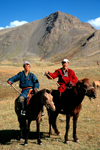 Mongolia - Uvs province: nomadic hearders posing posing with their horses - photo by A.Summers