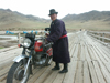 Mongolia - Arkhangai - Great White Lake / Terkhiin Tsagaan Nuur: man and motorbike - photo by P.Artus