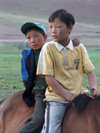 Mongolia - Moron: nomadic boys on horseback - photo by P.Artus