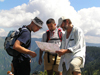Montenegro - Crna Gora - Durmitor national park: hikers reading a map - orientation - photo by J.Kaman
