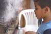 Asilah / Arzila, Morocco - boy buying kebabs - photo by Sandia