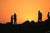 Asilah / Arzila, Morocco - popular place for sunset stroll - people silhouettes - photo by Sandia