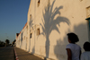 Asilah / Arzila, Morocco - palm tree shadow - waterfront street - photo by Sandia