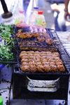 Agadir, Morocco: market - selling BBQ meat - kebabs - photo by Sandia