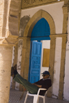 Mogador / Essaouira - Morocco: man relaxing in the afternoon - photo by Sandia