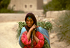 Morocco / Maroc - Imilchil: woman returning from the fields - broad smile - photo by F.Rigaud