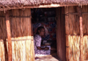Mozambique / Moambique - Bazaruto island: lady in a traditional house / mulher numa cabana- photo by F.Rigaud