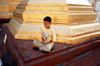 Myanmar - Yangon: boy meditating near a stupa - religion - Buddhism - photo by W.Allgwer - Junger Burmese meditiert in der Shwedagon-Pagode von Yangon. Meditation (lat. meditatio = das Nachdenken ber oder lat. medius = die Mitte) ist eine Konzentrat