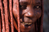 Namibia: Himba Woman face close-up, Skeleton Coast, Kunene region - photo by B.Cain