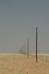Namibia: great expanse - endless phone line and fence - photo by J.Banks