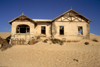 Namibia - Kolmanskop: ghost house claimed by the desert - photo by G.Friedman