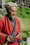 Nepal - Langtang region - old Tamang man carring a typical Nepali knife - photo by E.Petitalot