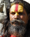 Kathmandu, Nepal: a follower of shiva has the symbol of the god painted on the forehead - photo by E.Petitalot