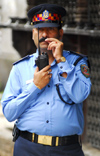 Kathmandu, Nepal: police chief with a walkie-talkie - photo by E.Petitalot