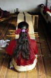 Nepal - Pokhara: working with a loom - Women Handicraft Center - women's movement - photo by W.Allgwer