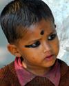 Pokhara, Nepal: boy with make up for a religious ceremony - photo by E.Petitalot