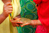 Kathmandu, Nepal: woman applying henna to hand - photo by J.Pemberton