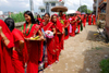 Kathmandu, Nepal: women with with offerings of flowers and fruits (prasadam) queue to enter Koteshwar temple, during women's festival - Teej - photo by J.Pemberton
