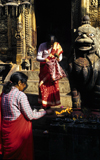 Changu village, Kathmandu valley, Nepal: Changu Narayan temple - women at the entrance of the Garuda shrine, famous for its Garuda idol - photo by W.Allgwer