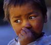Annapurna area, Nepal: close-up of a boy's face - photo by W.Allgwer
