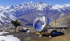 Annapurna area, Nepal: solar thermal collector - parabolic dish and mountains - photo by W.Allgwer