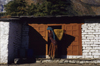 Annapurna area, Nepal: woman carrying a bamboo basket - photo by W.Allgwer