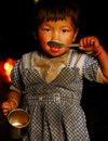 Sankhuwasabha District, Kosi Zone, Nepal: a young girl drinks tea - photo by E.Petitalot