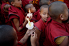 Kathmandu, Nepal: Tibetan monks - novices in a candle walk - boy monks - Buddhism - religion - photo by G.Koelman