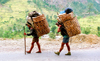 Nepal - Annapurna region - Anapurna: sherpas with large bamboo baskets (dhoko) - photo by G.Friedman