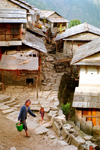 Nepal - Annapurna region: village - carrying potatoes - photo by G.Friedman