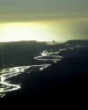 New Zealand - South island: Hokitika river - golden meanders, backlighted - from the air- photo by Air West Coast
